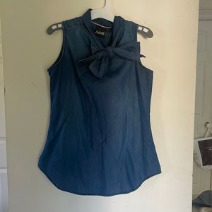 Adorable lightweight denim top with bow accent